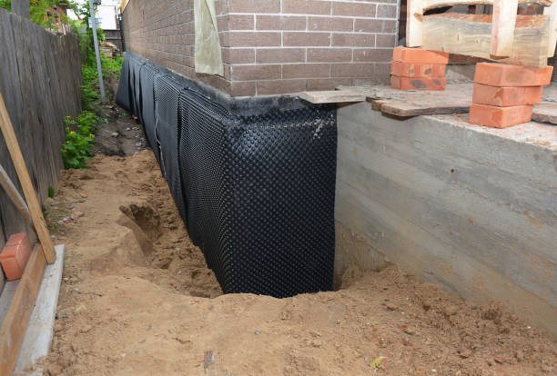 Happy homeowners after waterproofing job in Mulliken